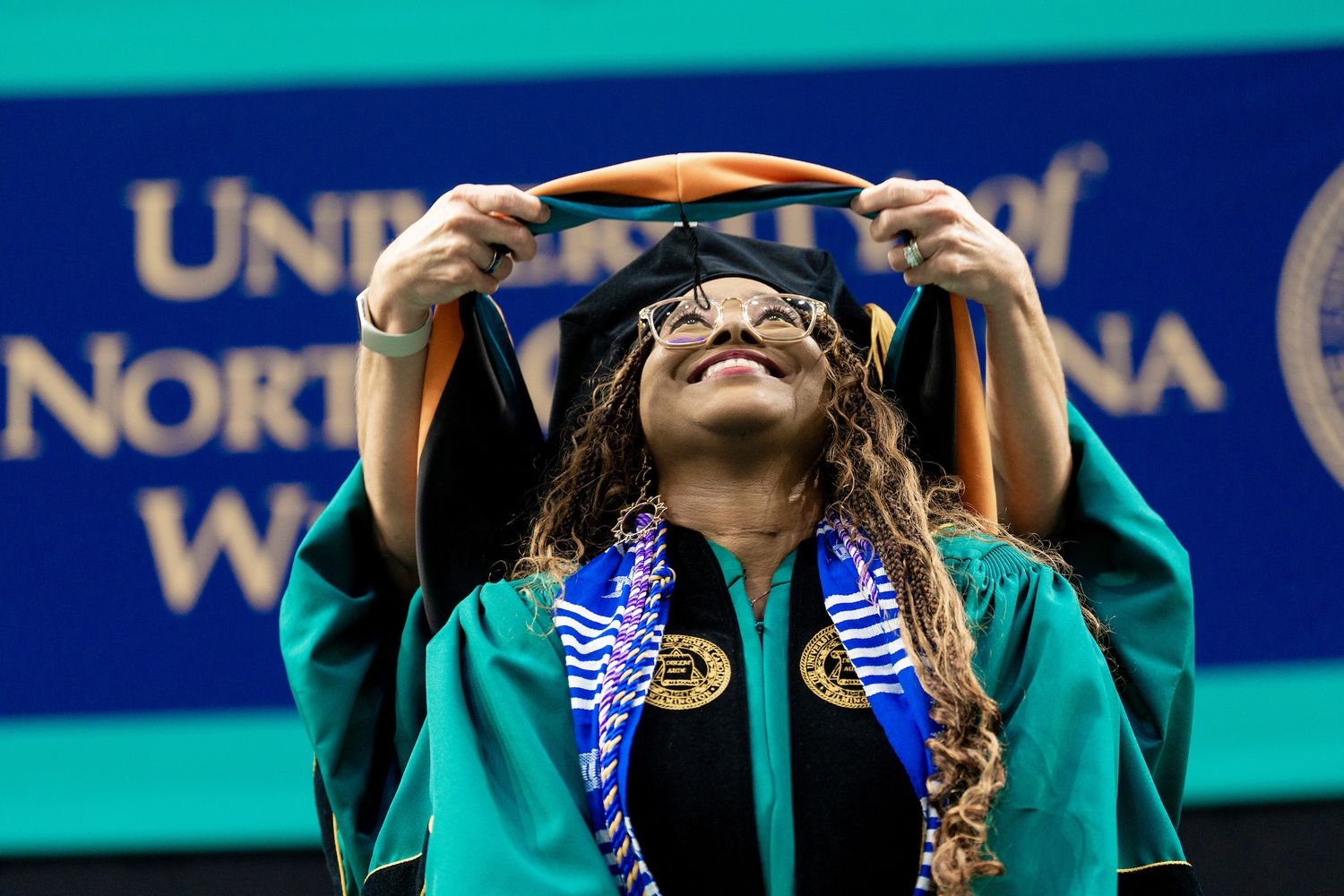 UNCW Doctoral graduates is hooded
