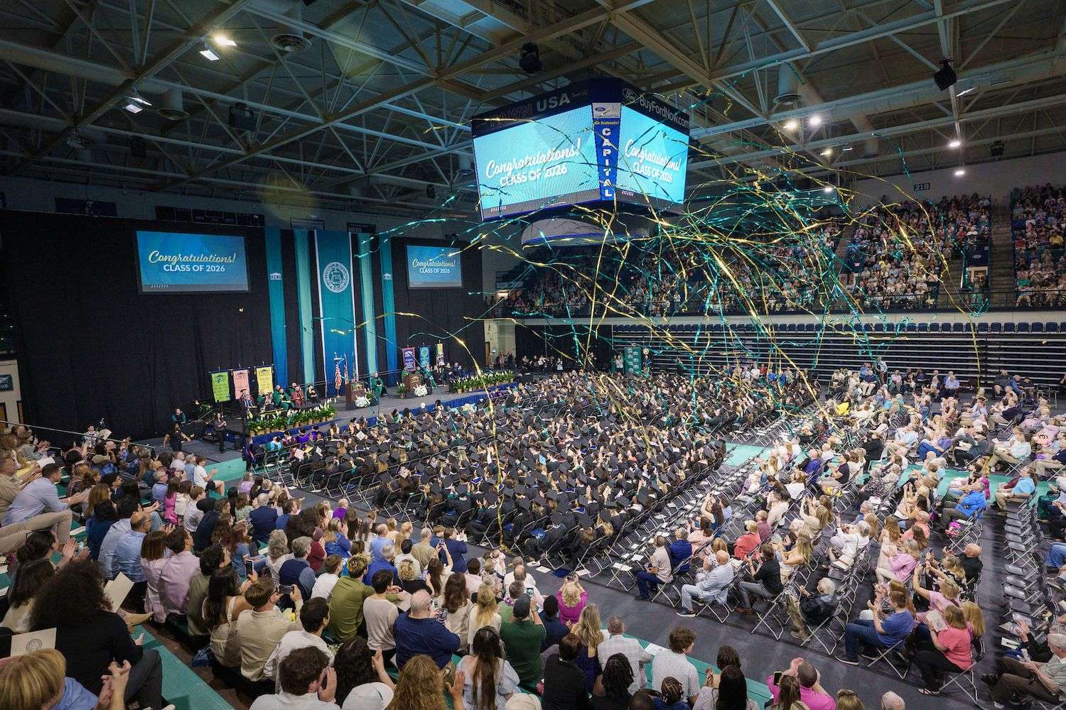 Confetti falls with the backdrop of spring commencement.