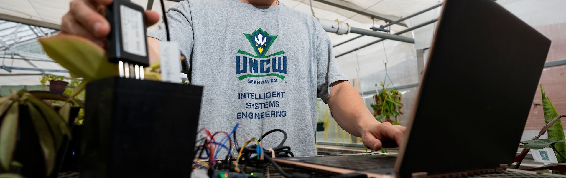 Picture of a intelligent systems engineering student working on project