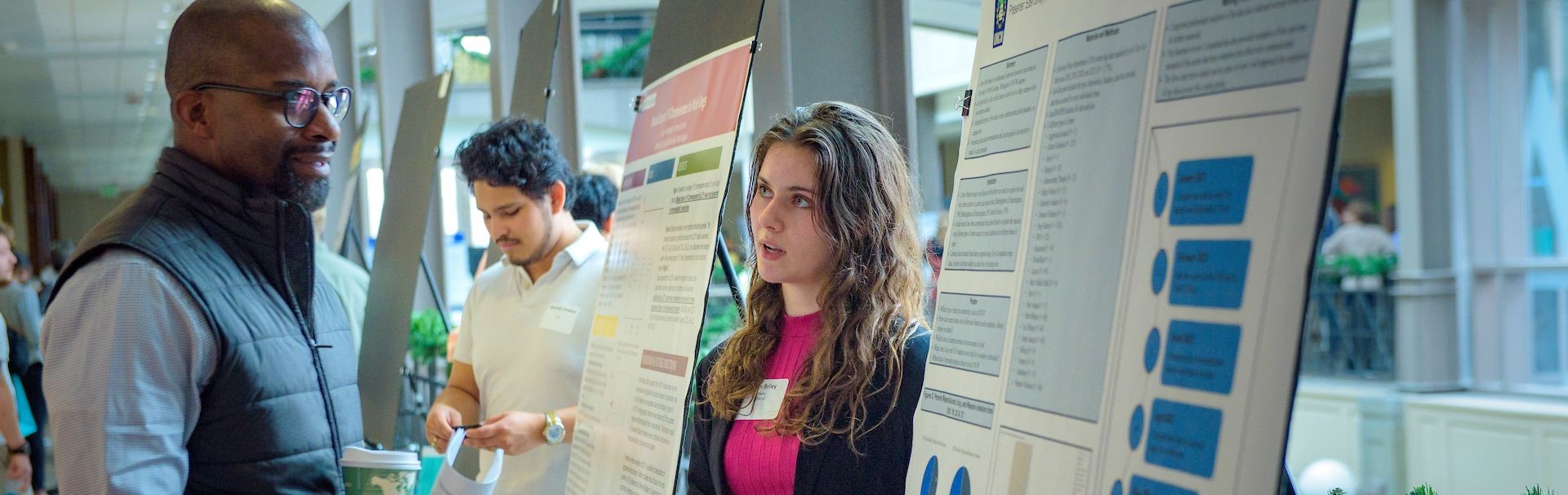 Student speaking at undergraduate Research and Creativity Symposium