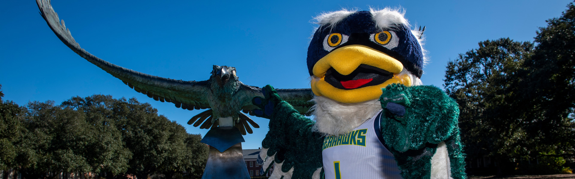 Sammy Mascot with the Seahawk Statue