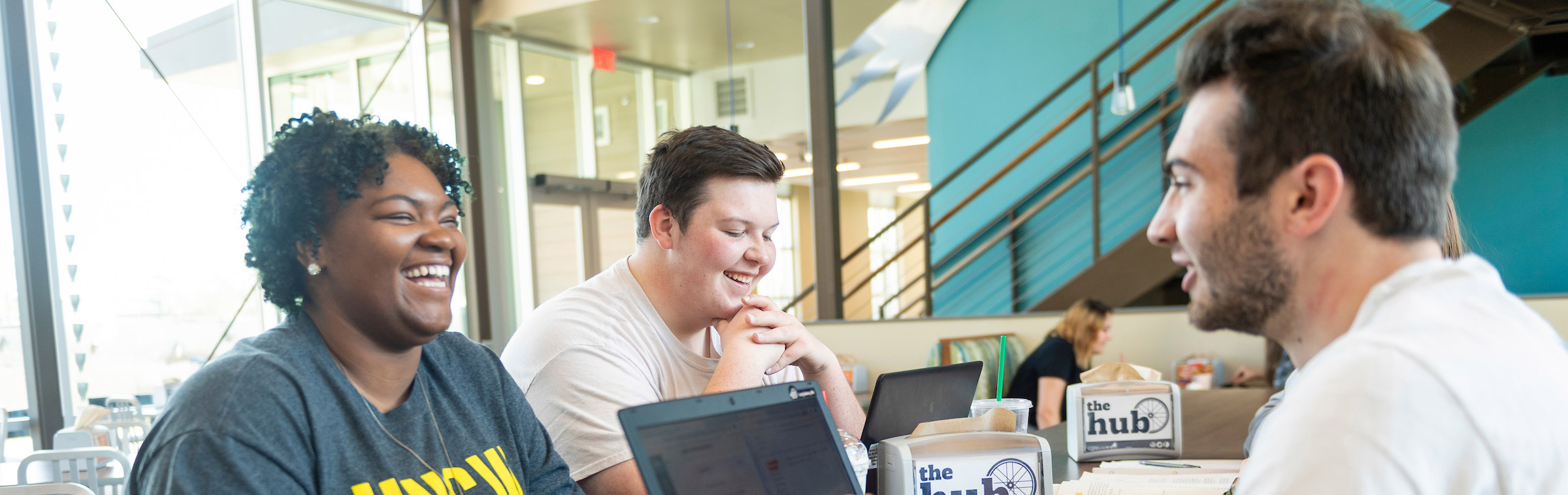 UNCW students engaging in conversation. 