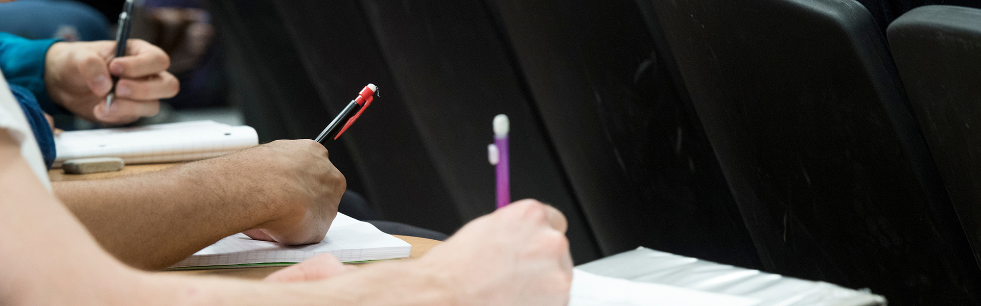 Student taking notes