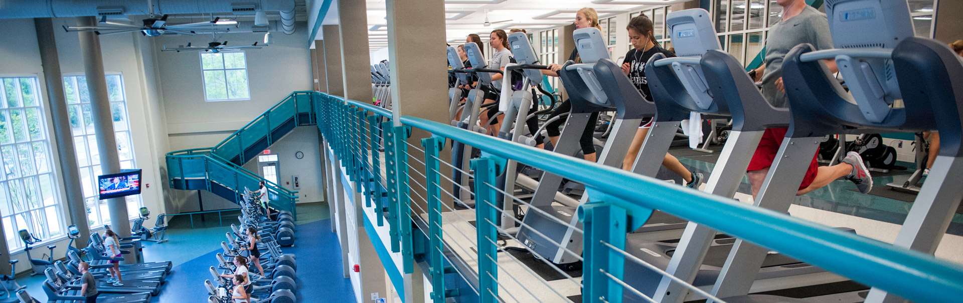 Patrons use the cardio deck and fitness equipment located in the Pat Leonard Student Recreation Center