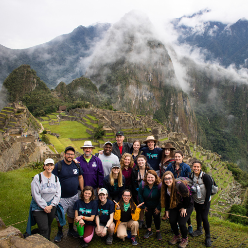 Group study abroad posing in Peru