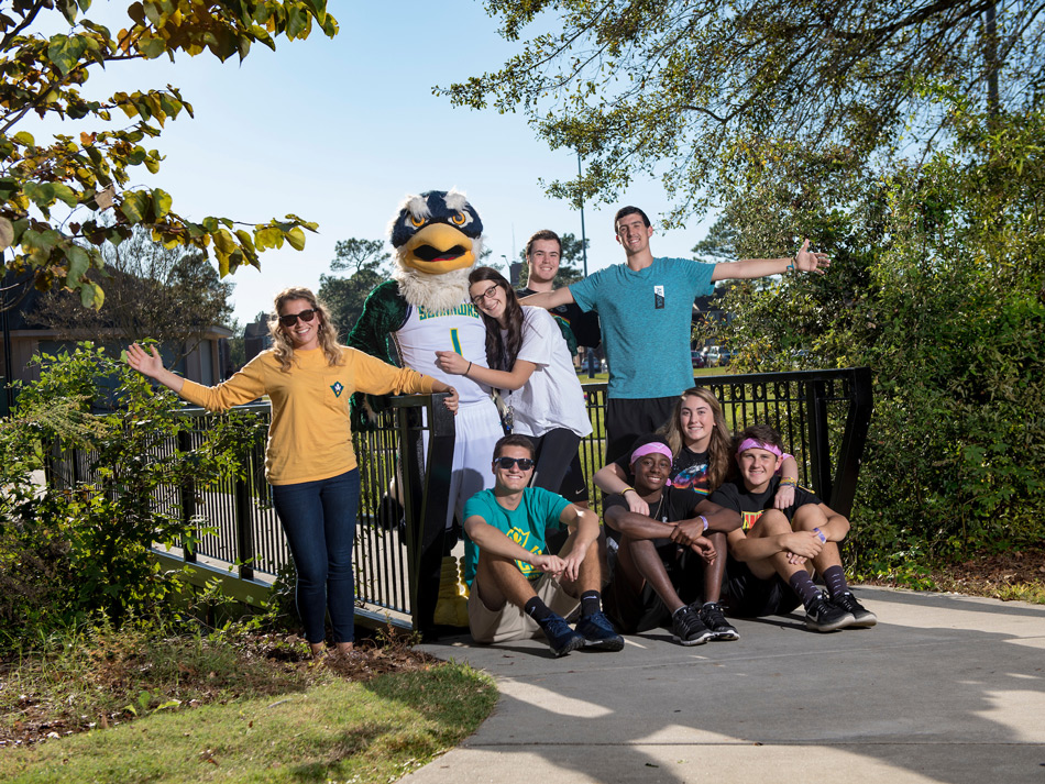 Students and Sammy Seahawk pose for a picture on our beautiful campus