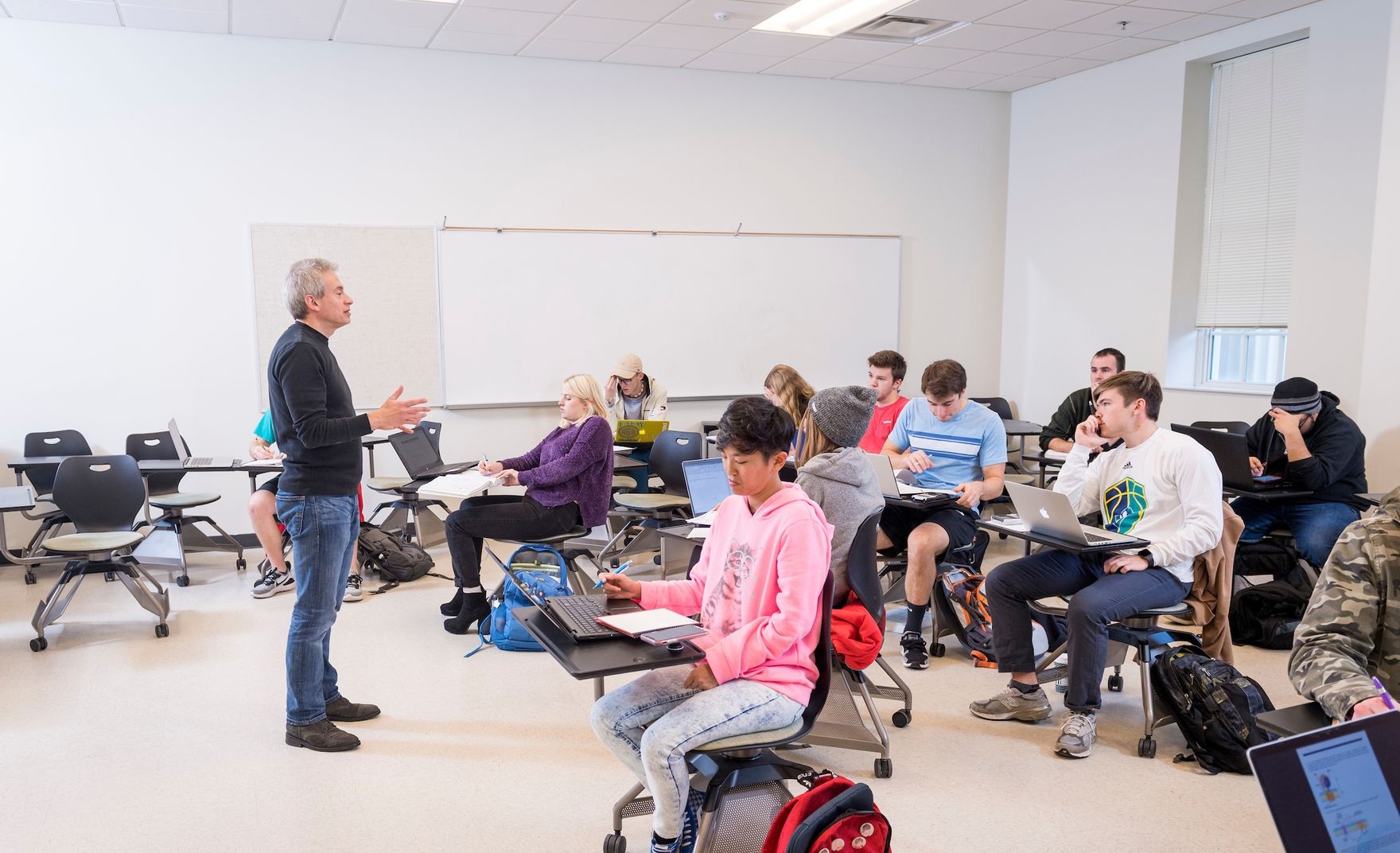  An instructor addresses a classroom full of students
