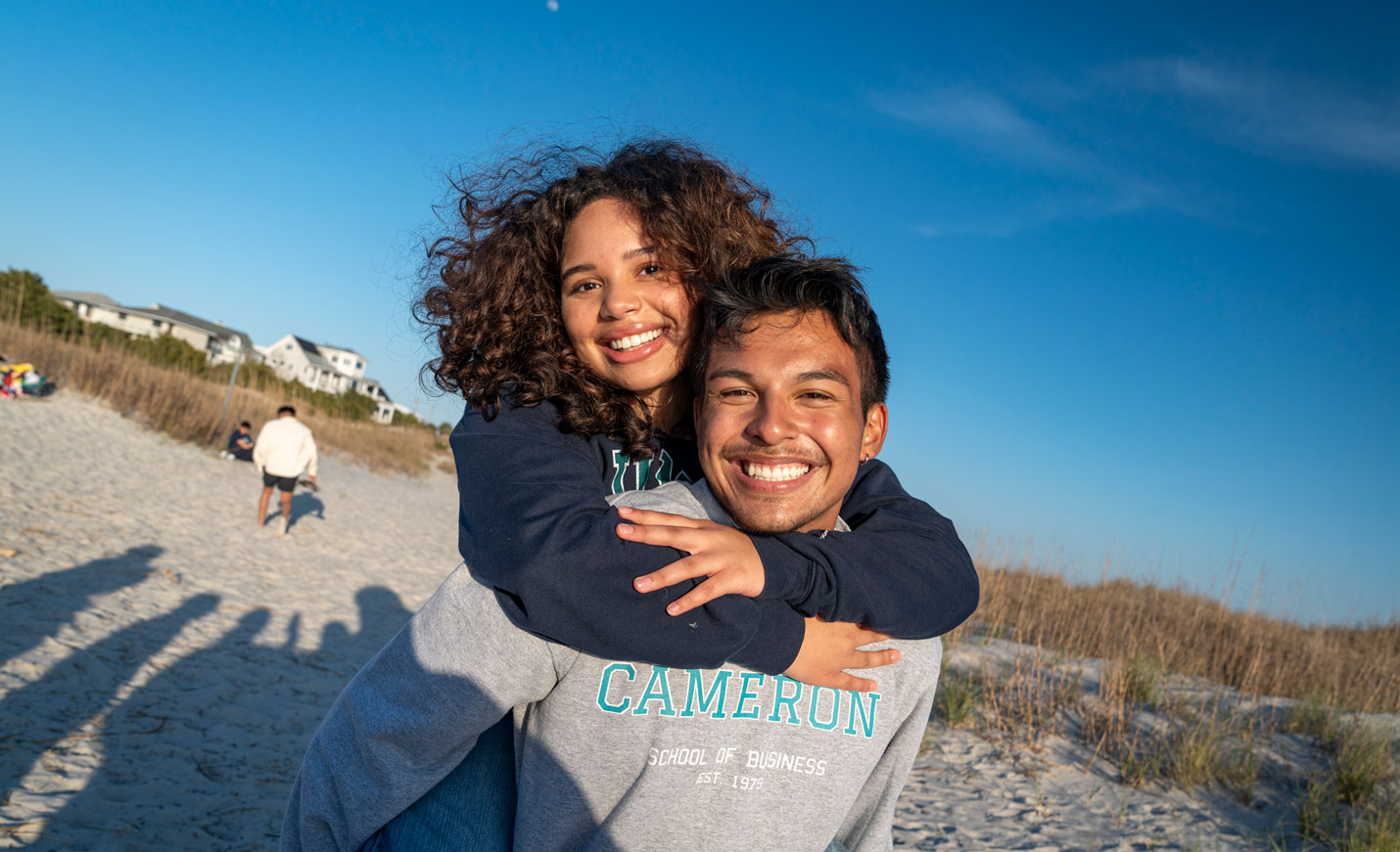 Two people hugging on the beach
