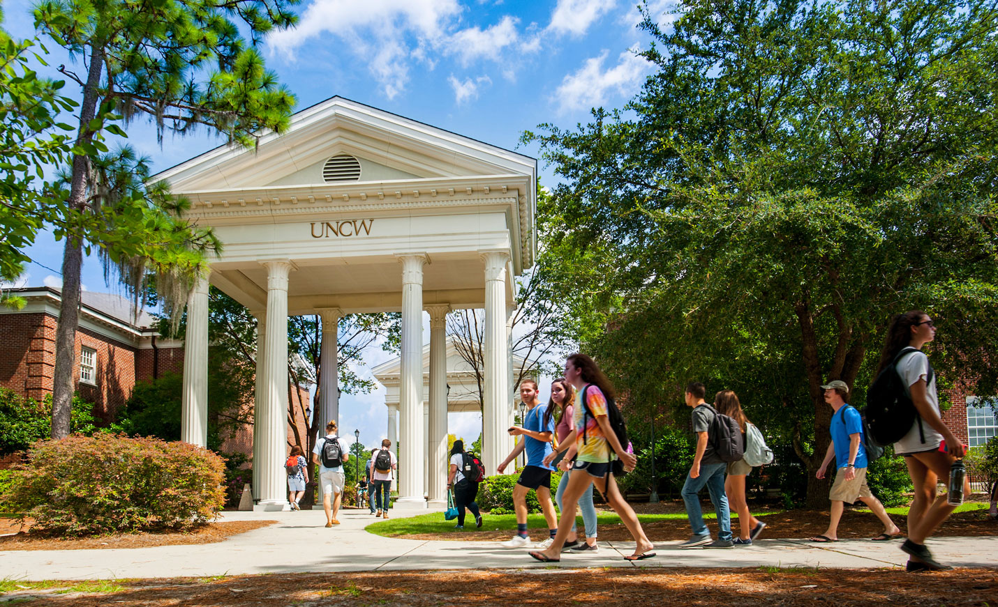 Students walking near the Northeast campus entrance
