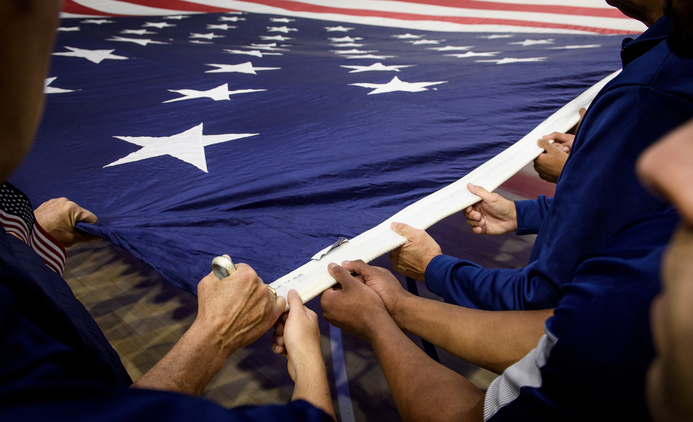 People holding American flag