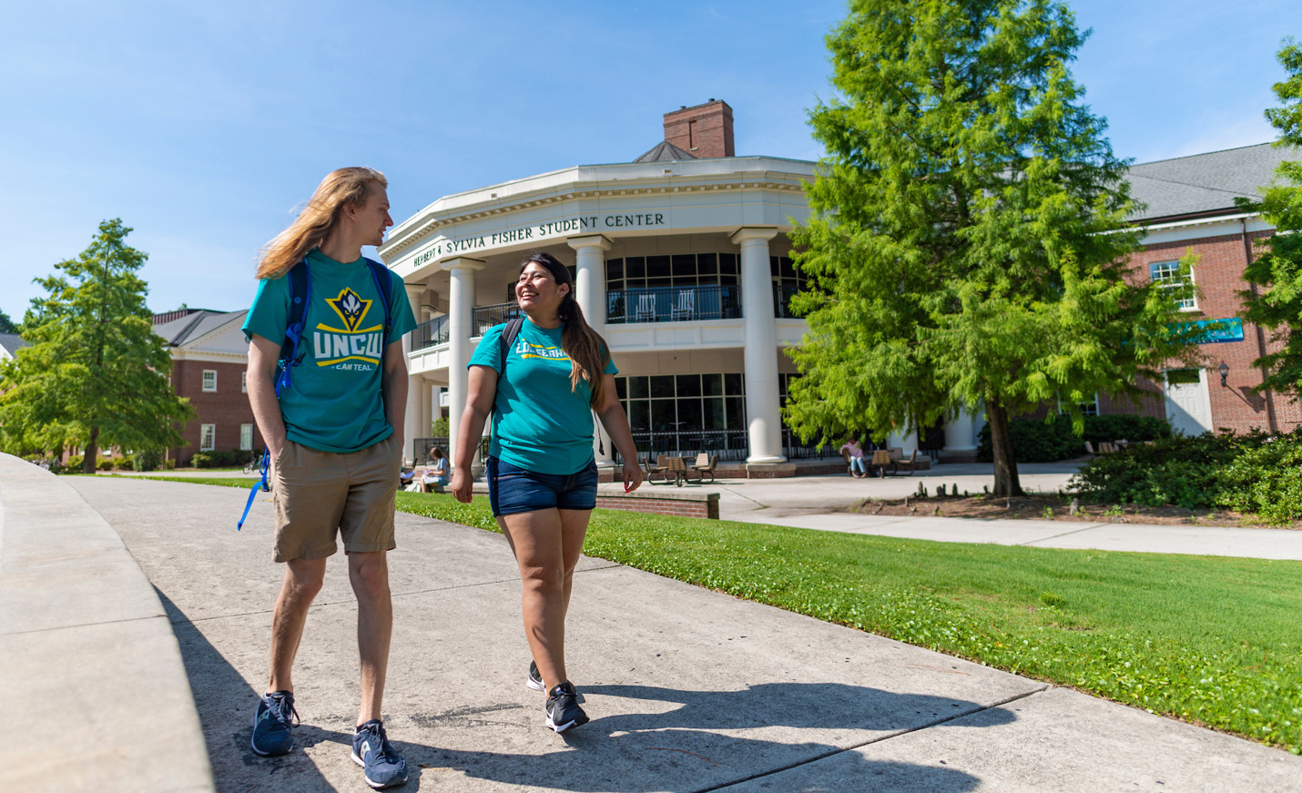 Students walking in front of the fisher student union