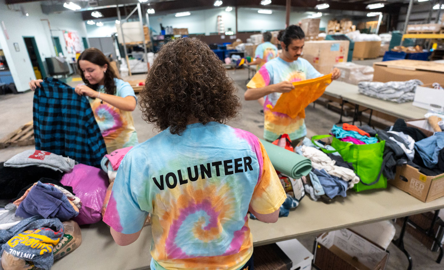 Volunteers folding shirts