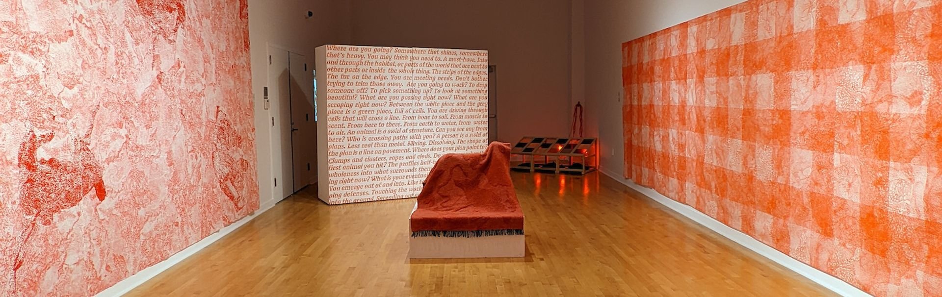 Madison Creech's exhibition composed of red and white wall textiles