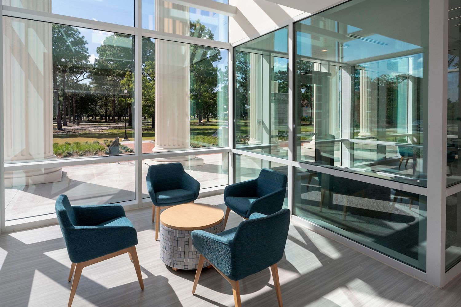 Sun shines through windows onto seating area on first floor of Discovery Hall