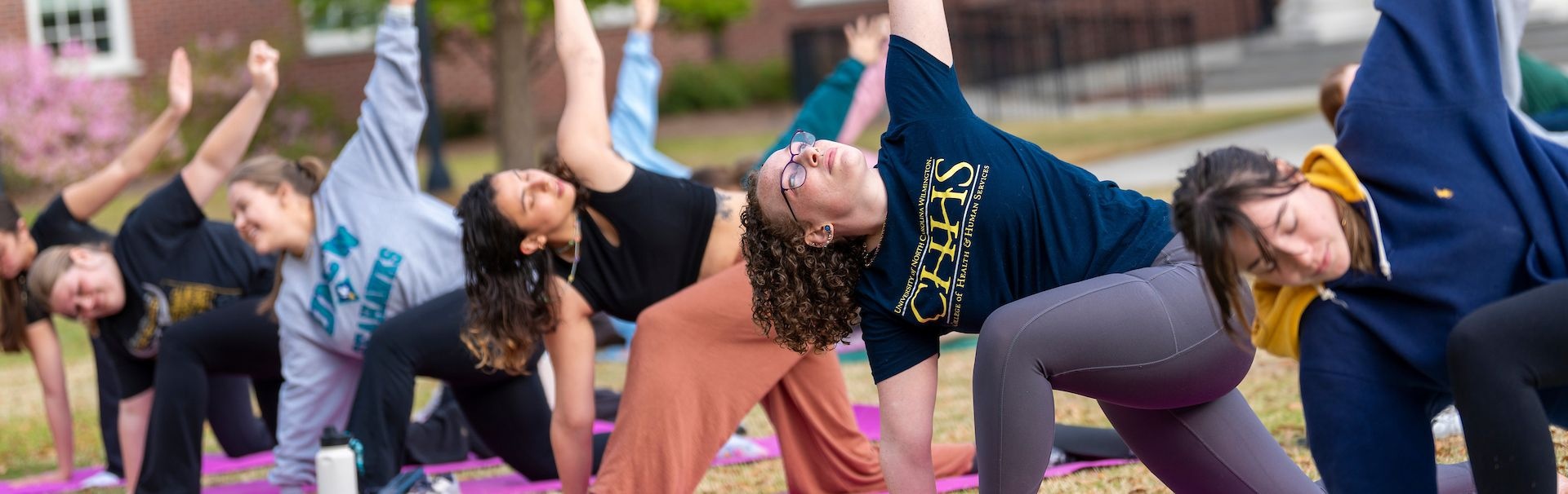 CHHS students participating in yoga week and stretching