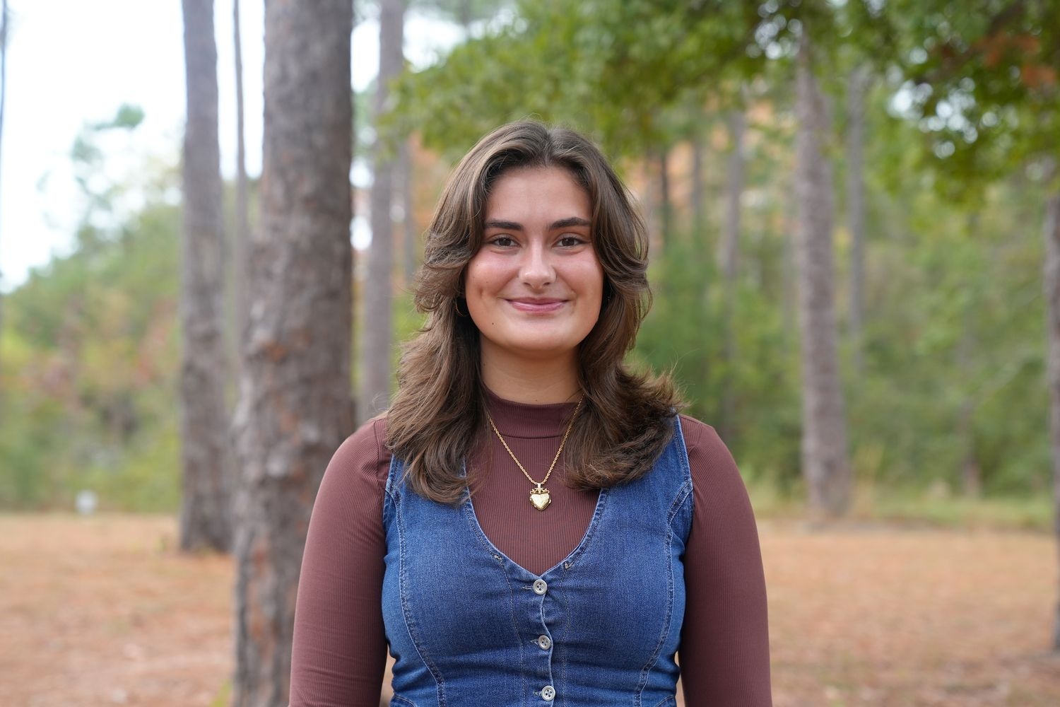 photo of student Winona West outside behind Cameron Hall