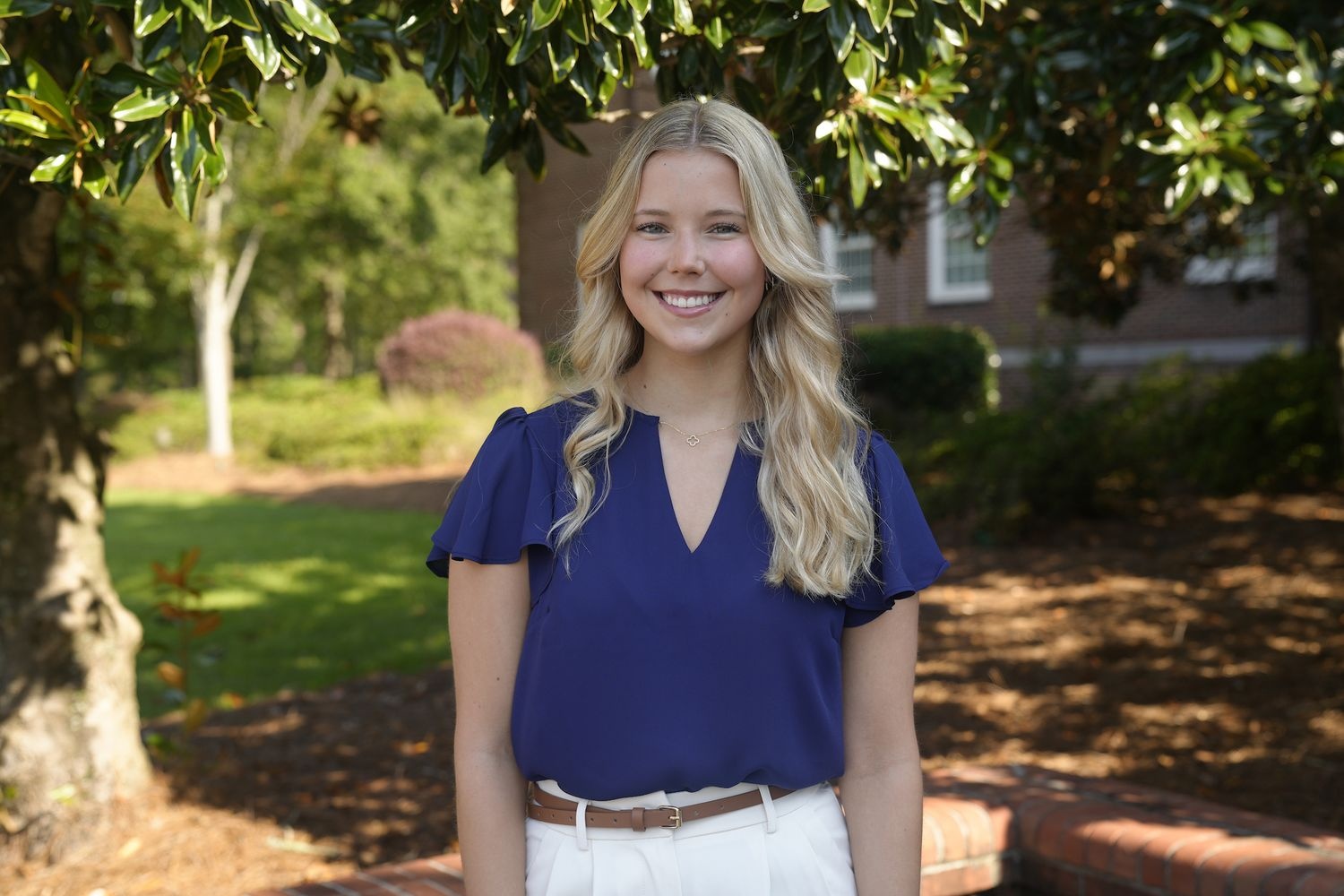 female with blonde hair smiling