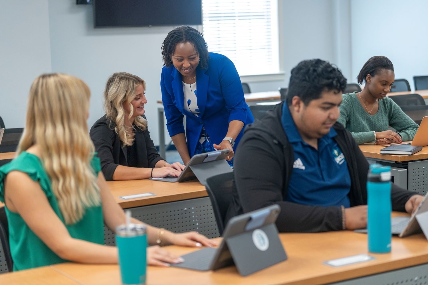 Professor instructing students in classroom 