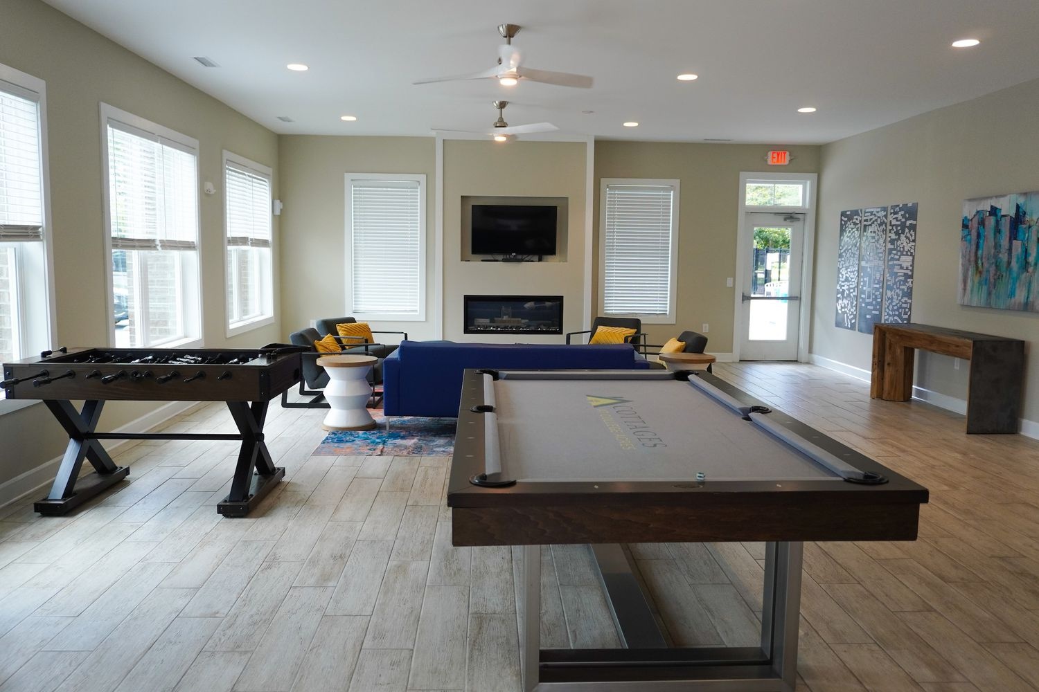 Leasing office and rec center with pool tables at the Cottages at College Acres