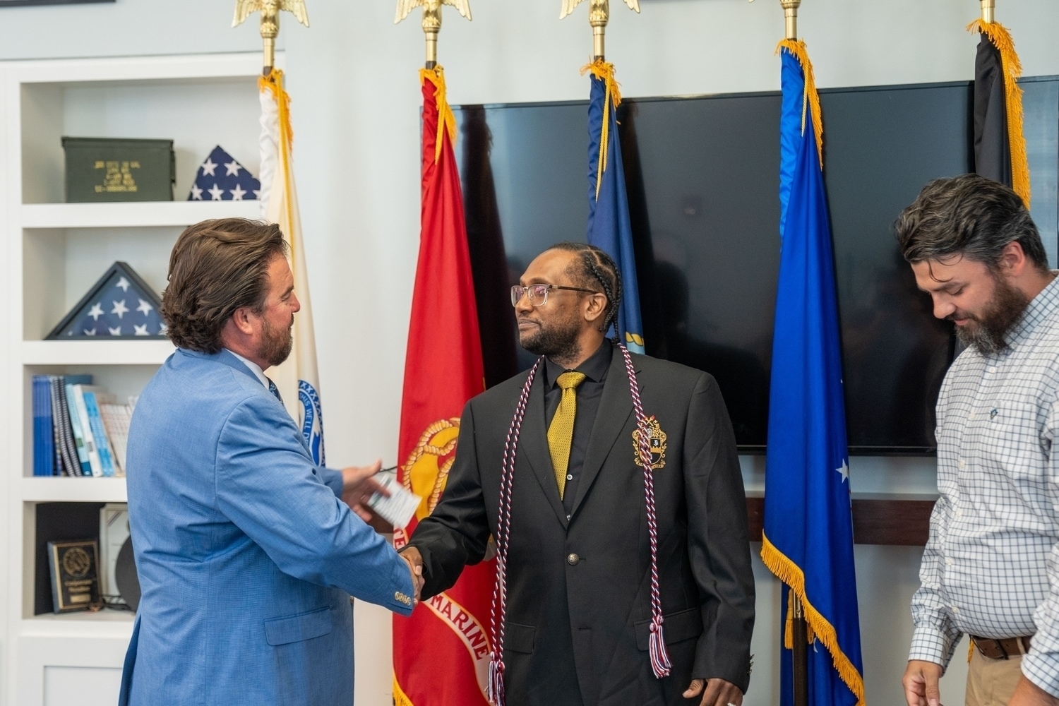 someone shaking hands with someone else