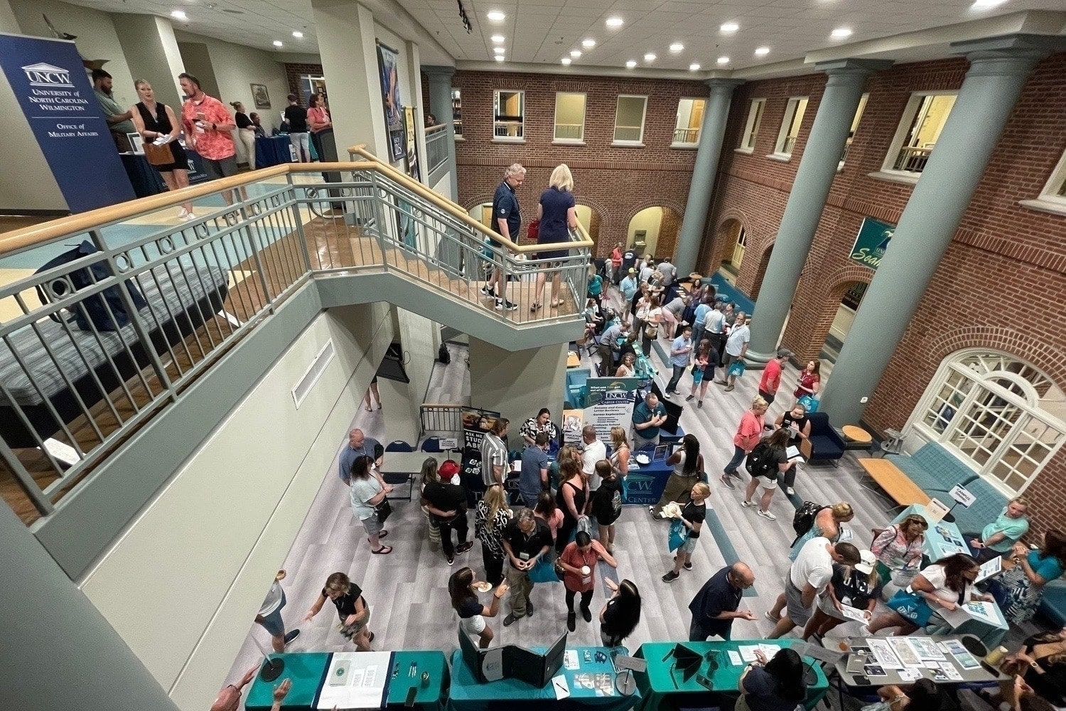 wide shot of orientation with various people