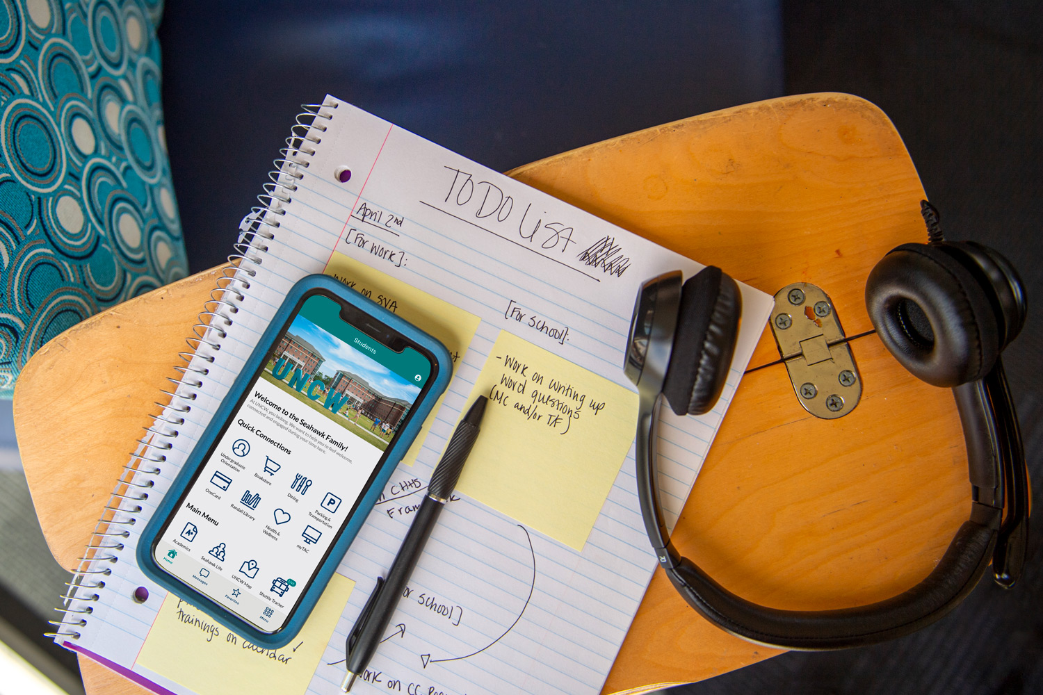 UNCW - Mobile app is shown on a phone