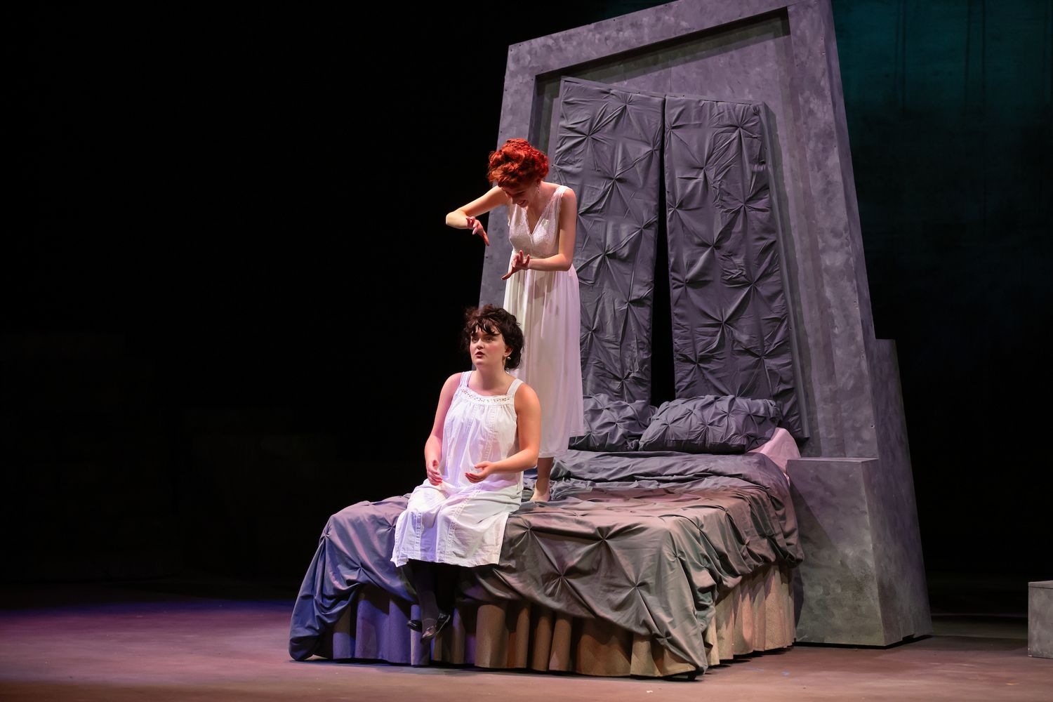 Two actresses on stage during a play