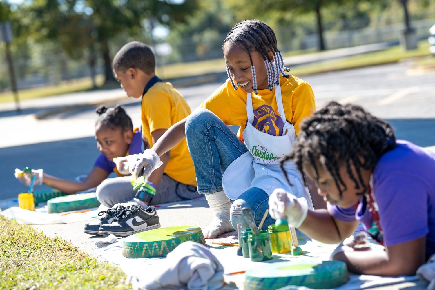 Virgo students painting a "Hungry Caterpillar"