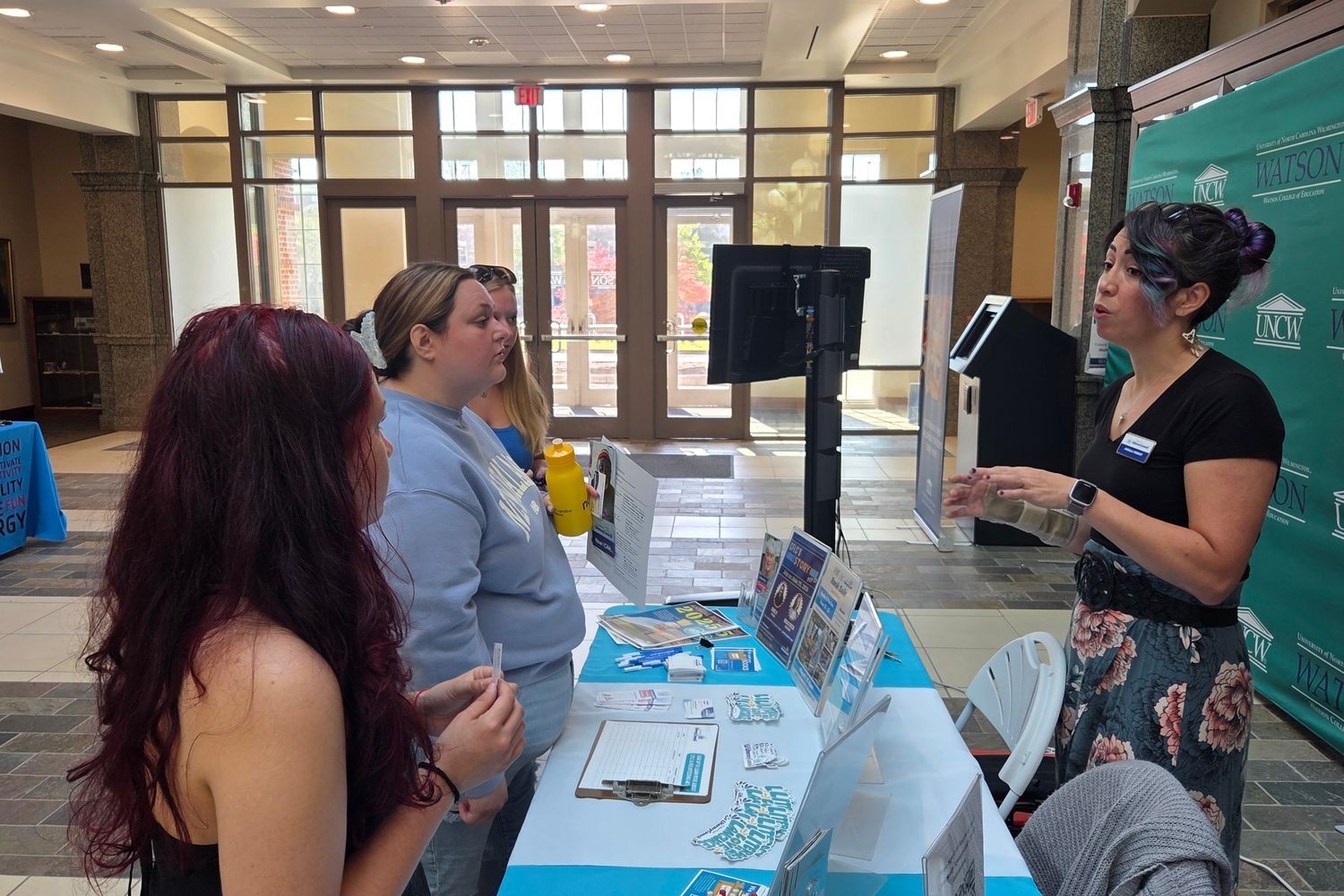 Students and faculty talking with the Cape Fear Literacy Council