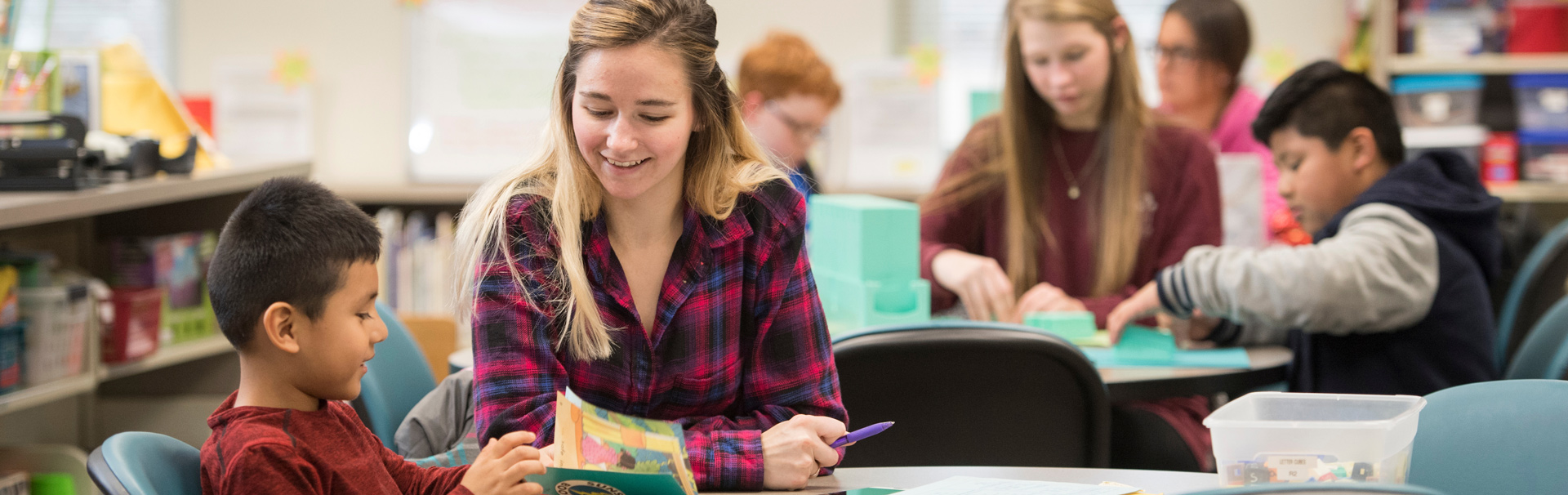 Reading a picture book in class with youth