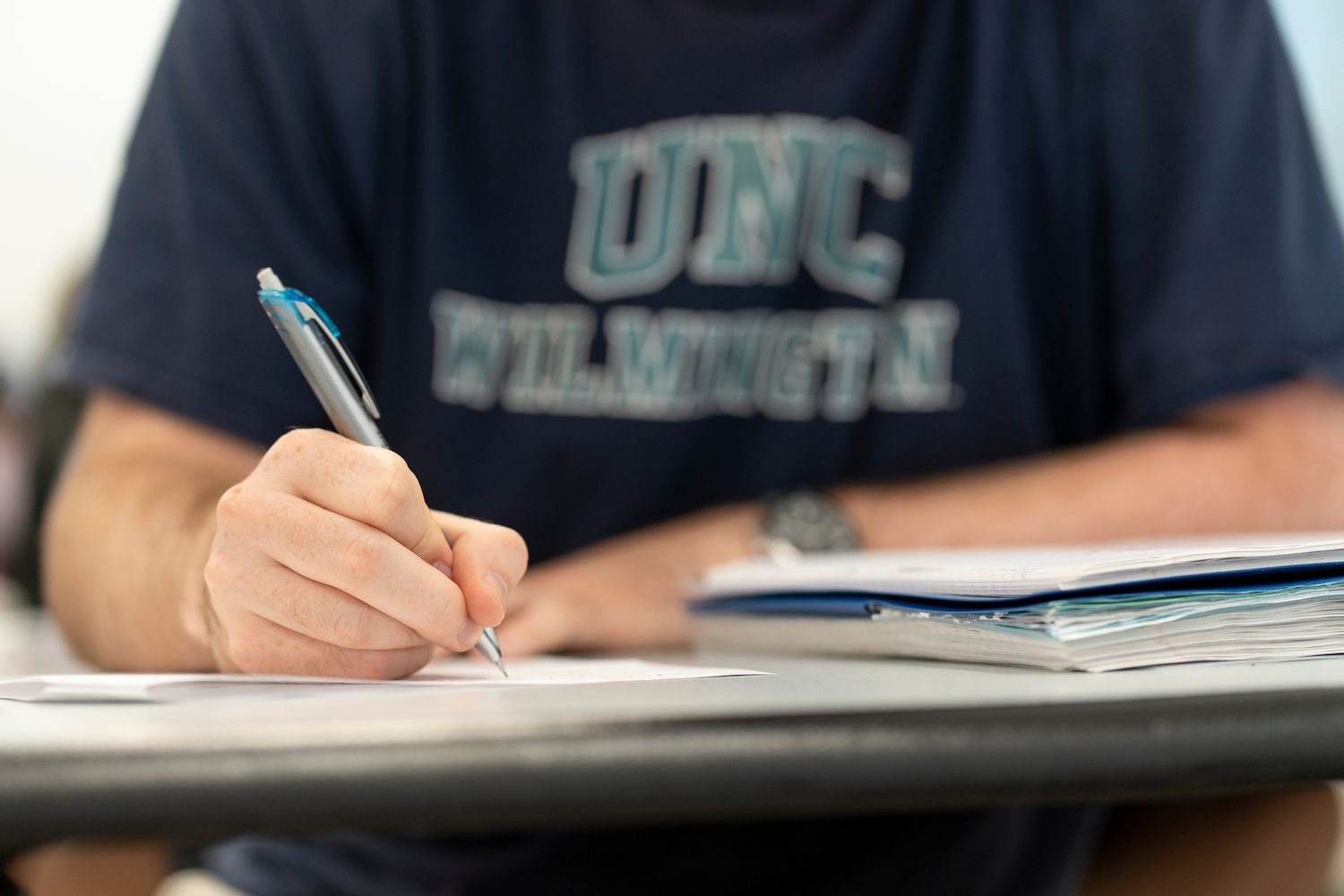 Student writing in class
