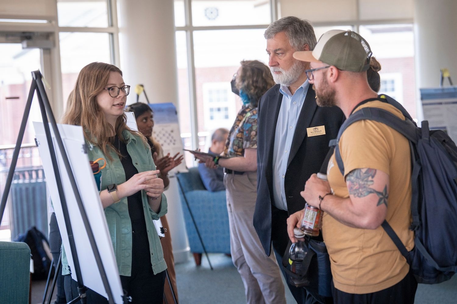 Student presents research poster