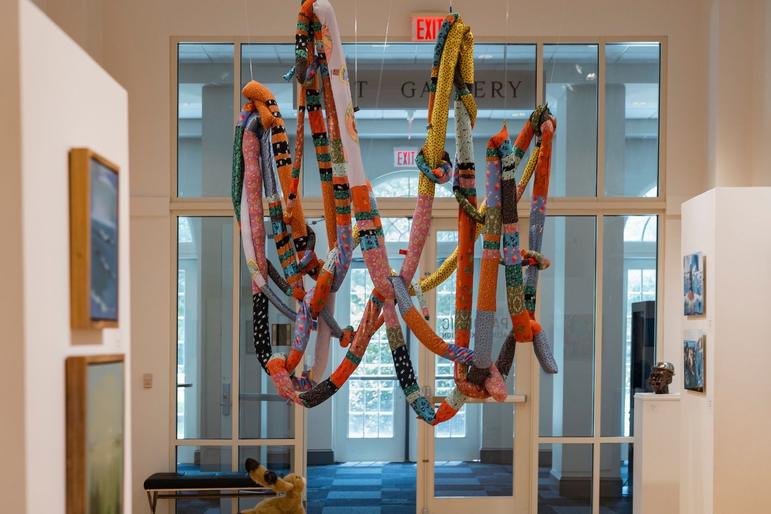 Colorful stringy art piece in an exhibit