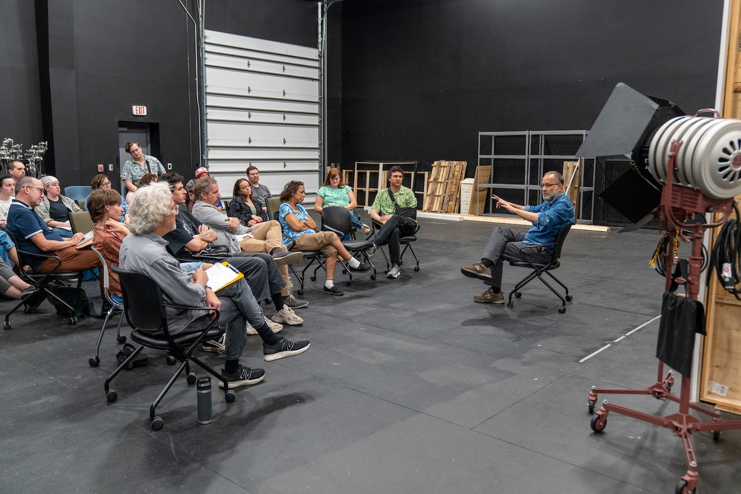 Film studies students in a work shop listening to a lecture by a visiting film maker