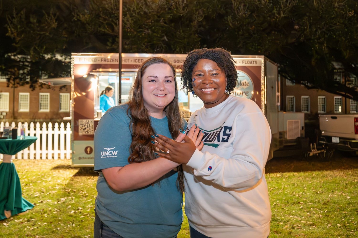 two women posing for a photo on UNCW campus