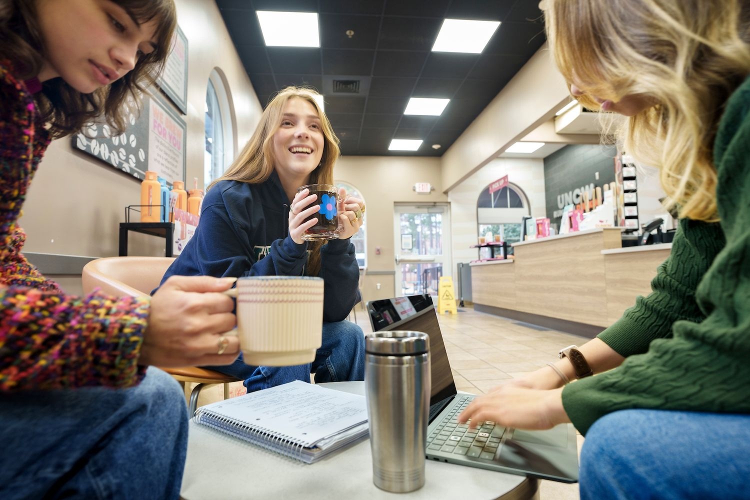 Students using reusable mugs on campus