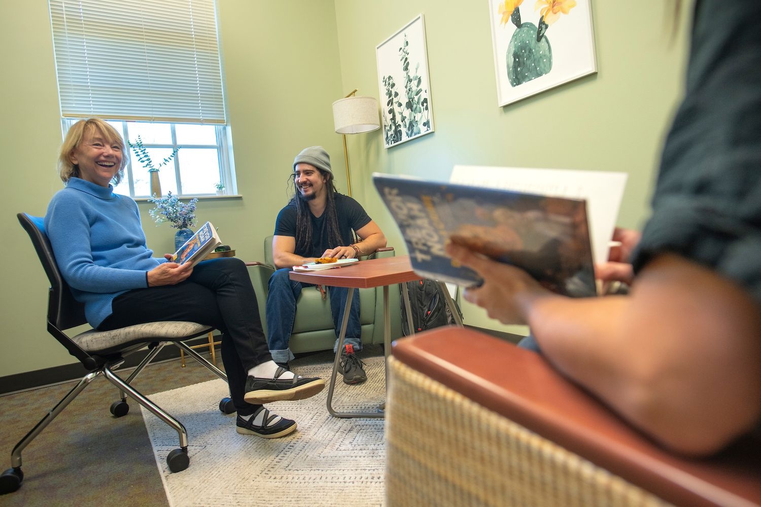 Pyschology Professor Sally MacKain leads a Book Club discussion with students