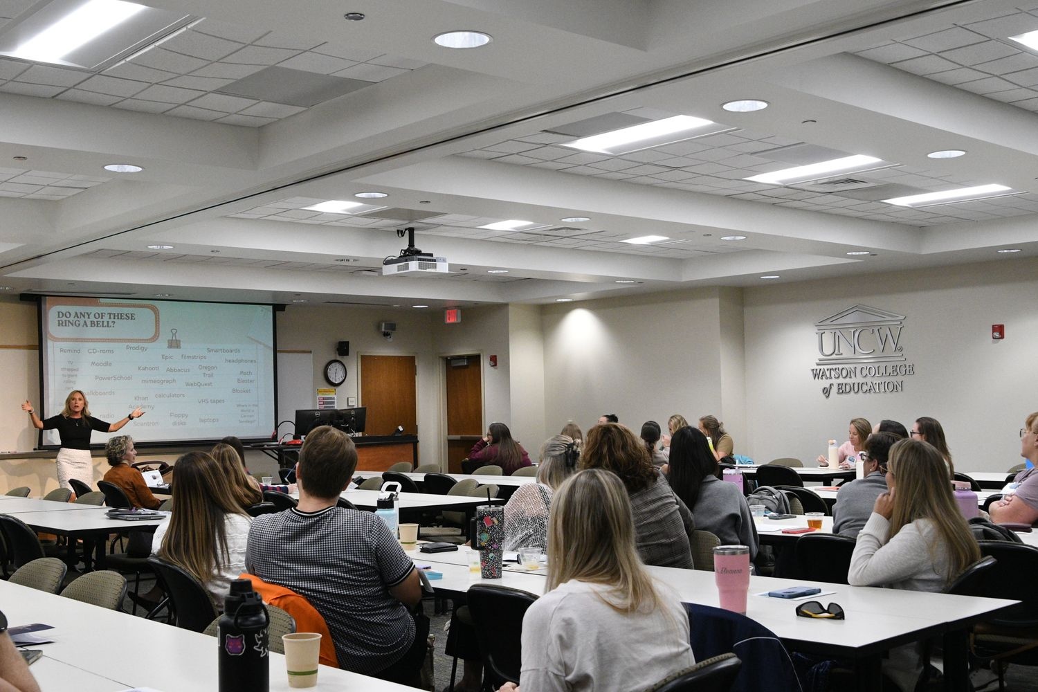 Classroom of people watching a slideshow presentation