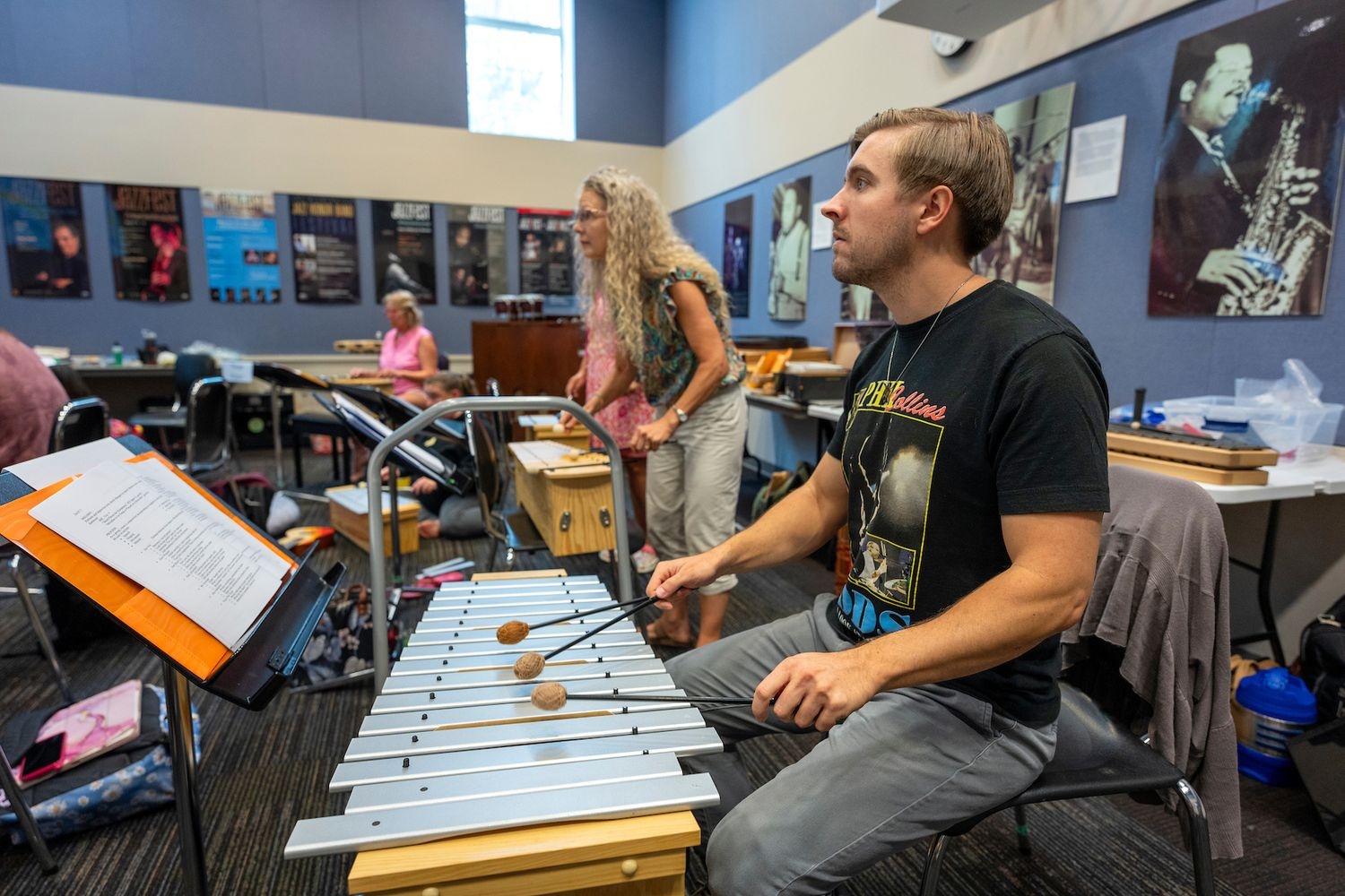 Person playing instrucment where Participants took part in a variety of classes centered around the Orff Approach, a developmental approach used in music education. 