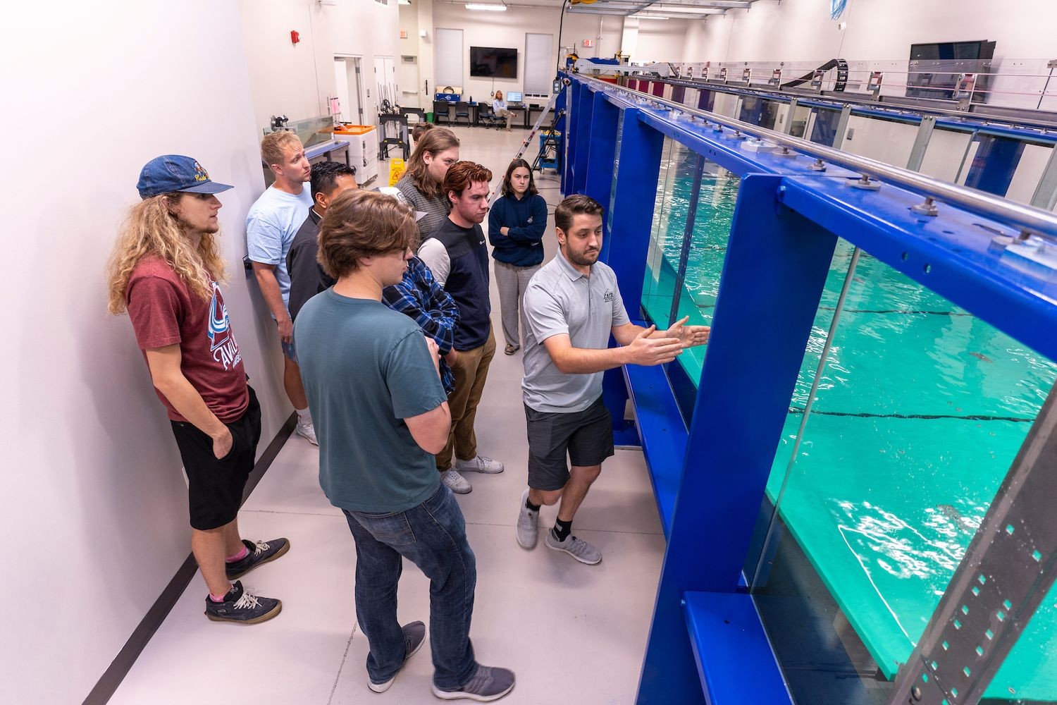 Teacher explaining how the Wave Flume machine works