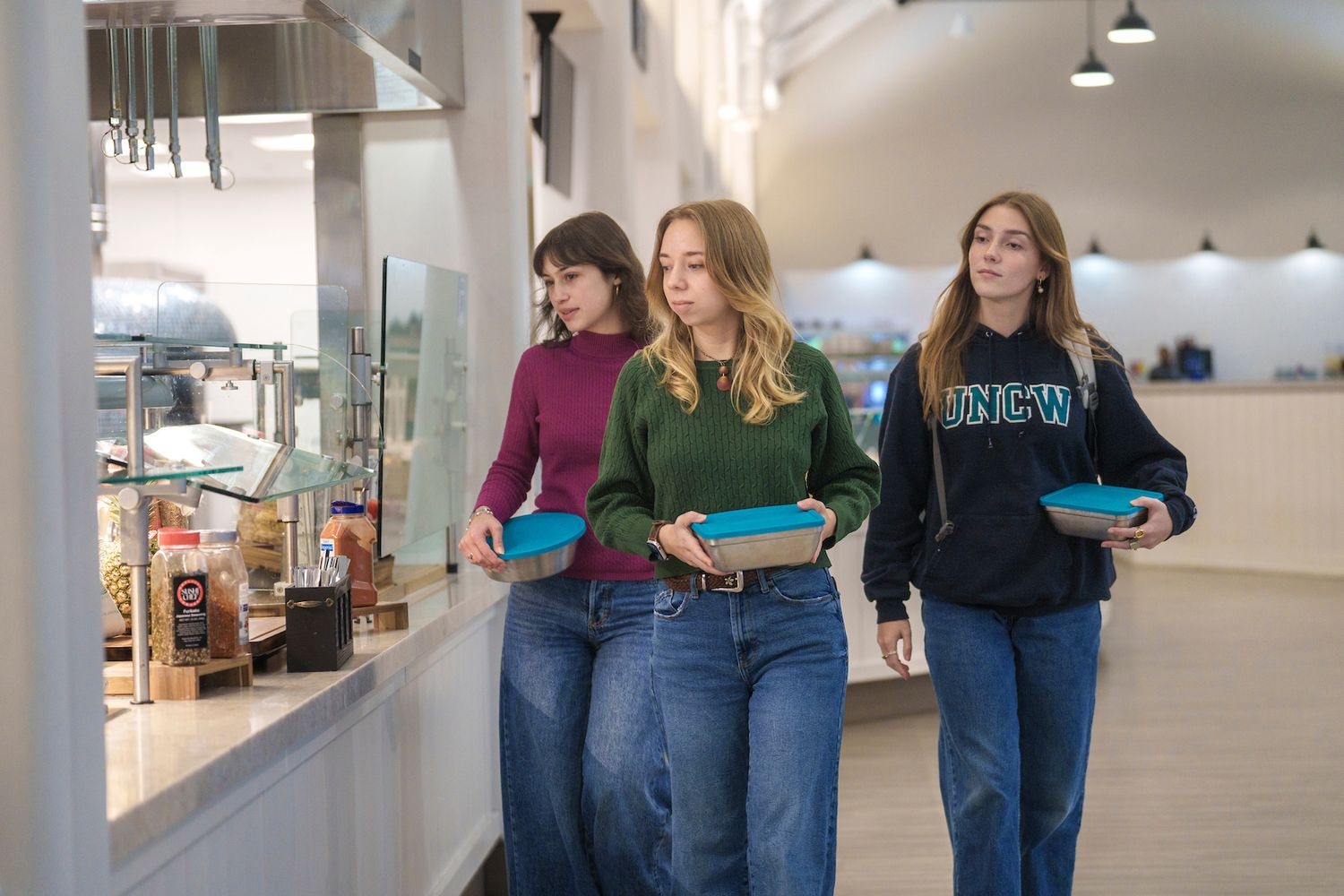 Students using reusable containers at dining locations on campus