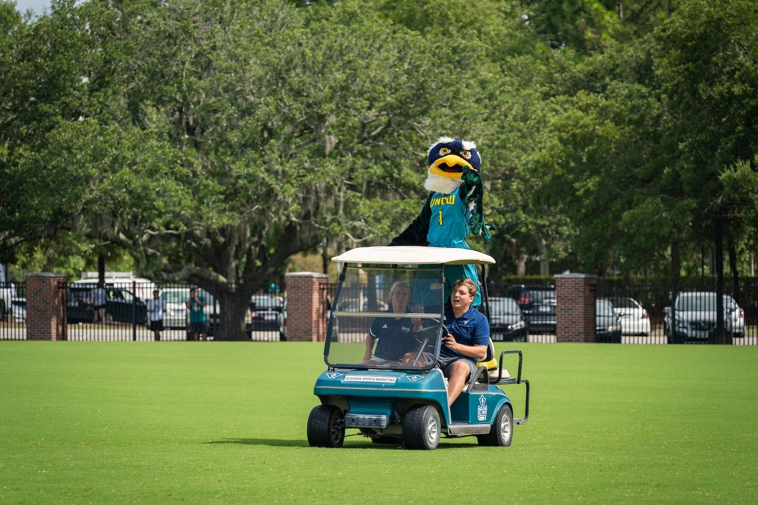 Sammy C. Hawk Mascot on a golf cart