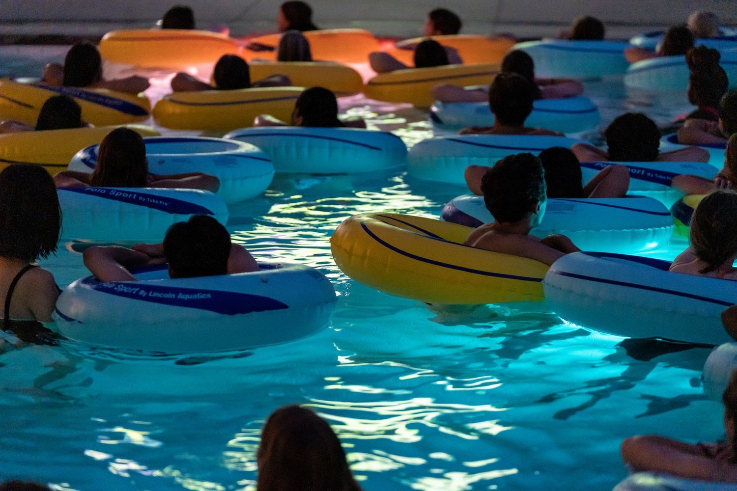 Students in pool during Dive-In Movie