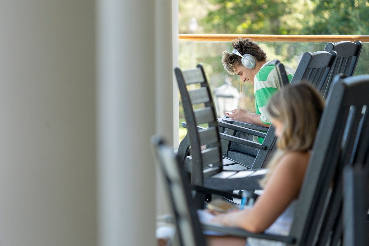 Students studying in chairs outside