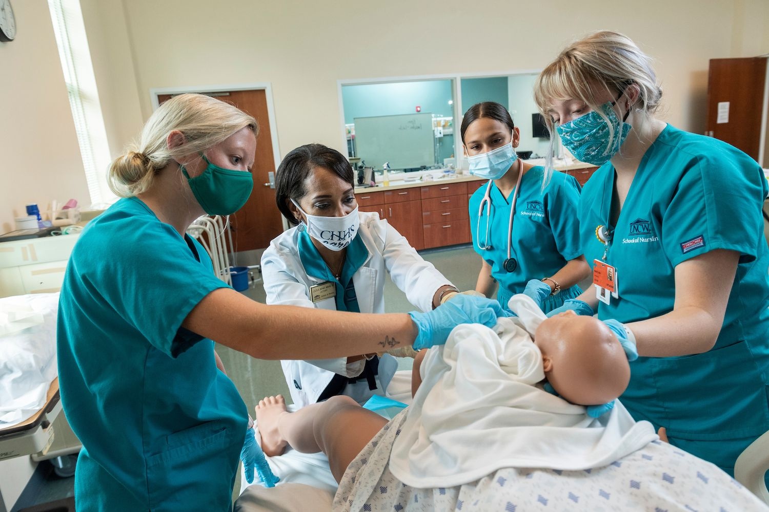 Nursing students participate in a simulated ob-gyn clinic