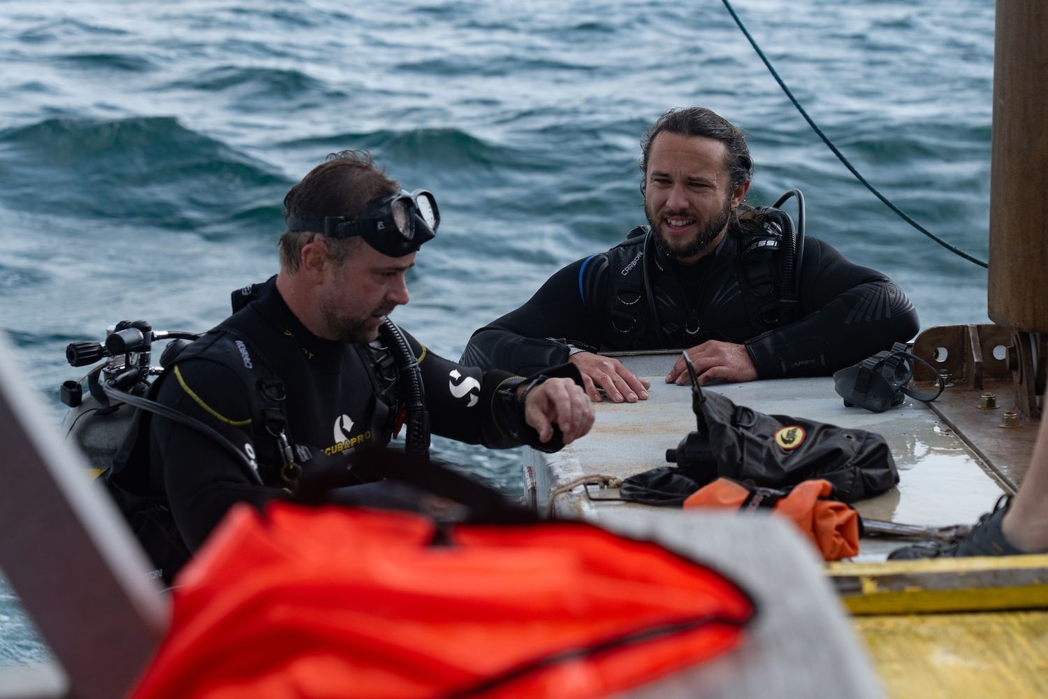 Students helping place buoy out in the ocean