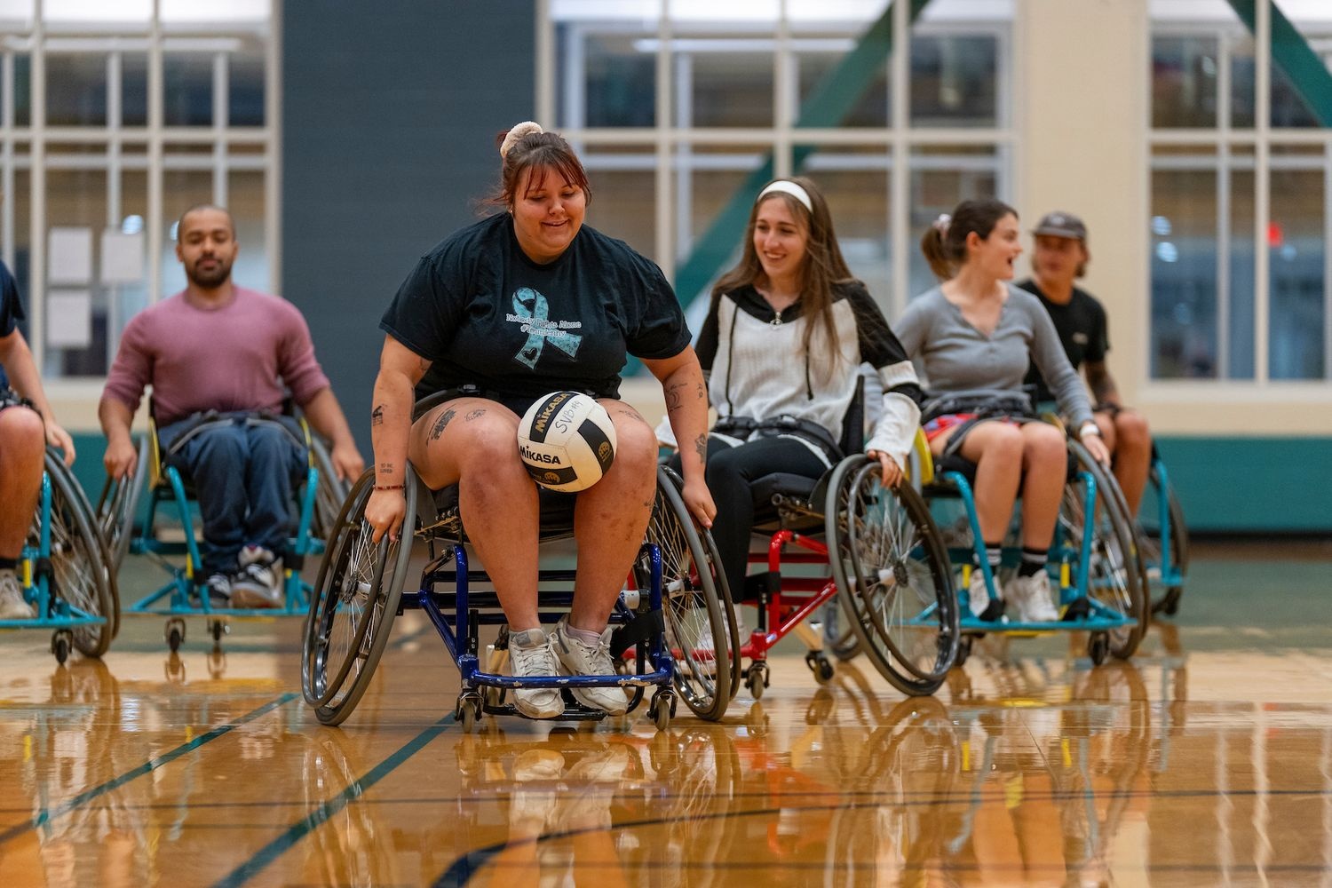 People playing wheelchair rugby