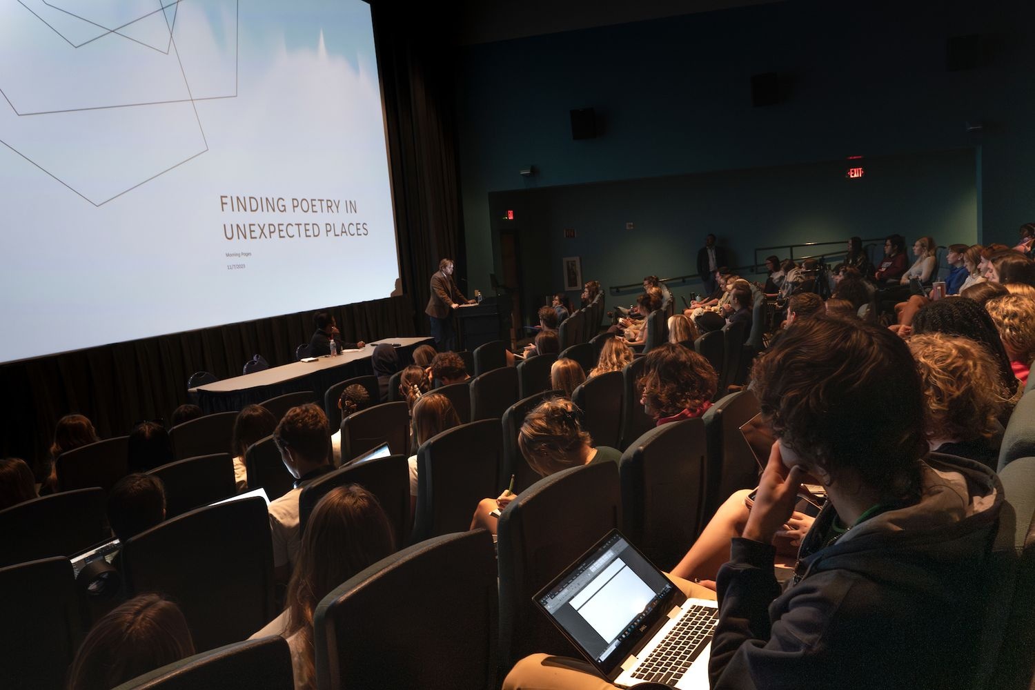 Audience seated listening to lecture in a lecture hall