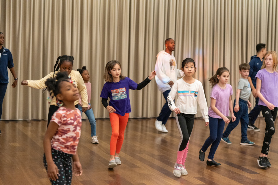 Youth participants dancing in dance class