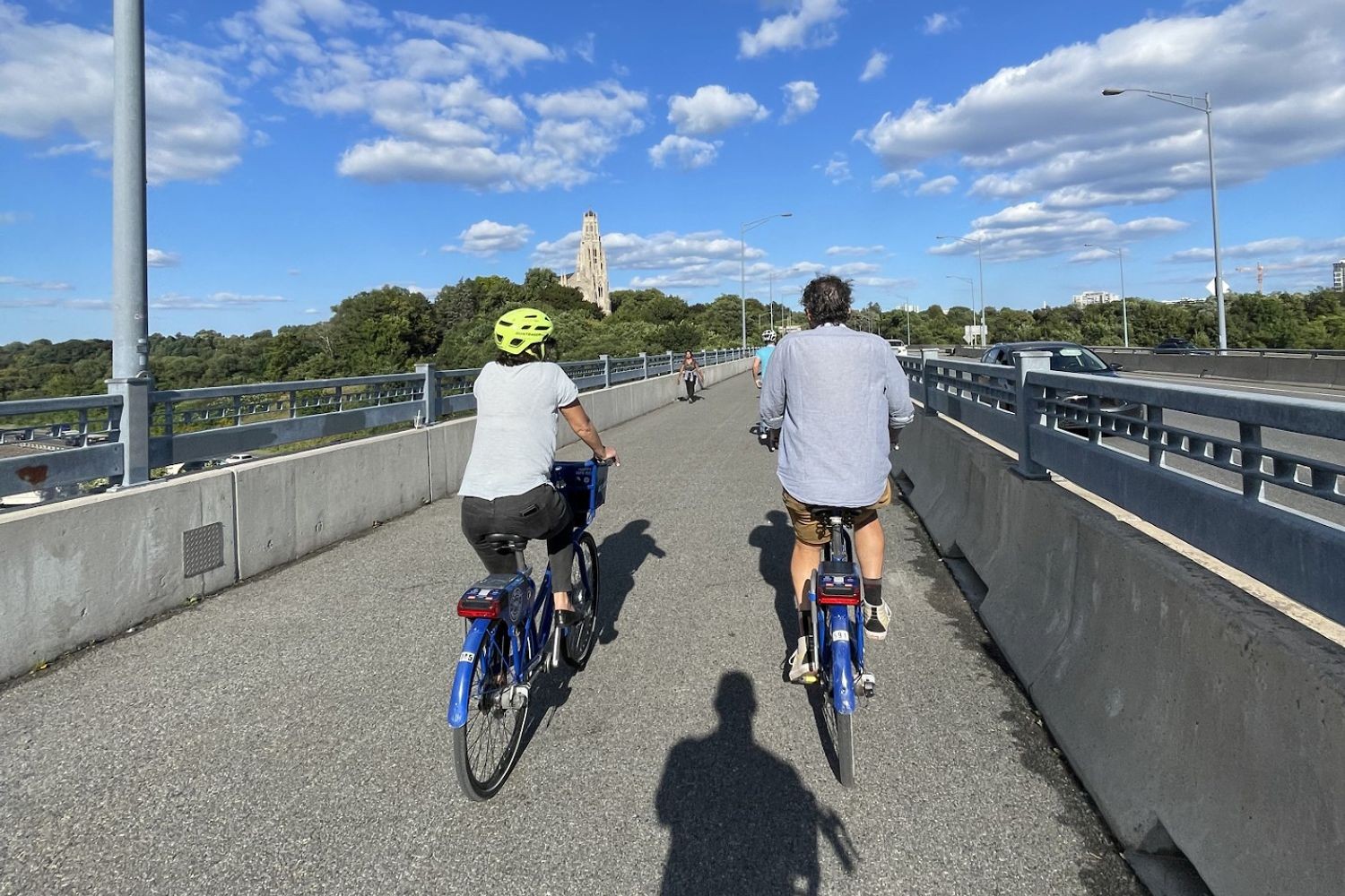 Bicyclists on a street in Canada riding bikes. 